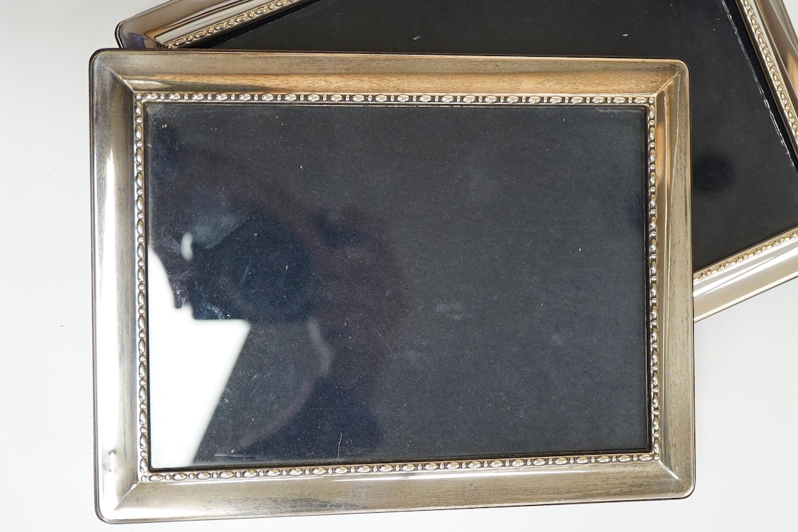 A pair of modern silver mounted photograph frames, 20.8cm and matching larger frame, 23.2cm, by Carr's of Sheffield, Ltd, Sheffield, 1996, together with one other modern silver mounted photograph frame and a similar Ital